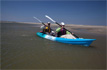 Paddling the Feelfree Gemini Sport at the beach